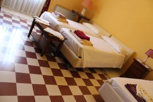 Säng eller sängar i ett rum på Il Casale dei Conti