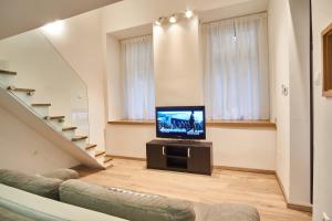 Televízia a/alebo spoločenská miestnosť v ubytovaní V27 Apartment | hostAID