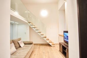 Televízia a/alebo spoločenská miestnosť v ubytovaní V27 Apartment | hostAID