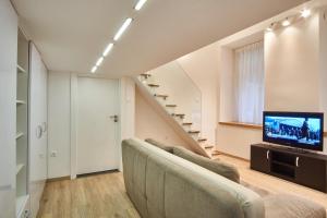 Televízia a/alebo spoločenská miestnosť v ubytovaní V27 Apartment | hostAID