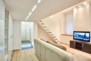 Televízia a/alebo spoločenská miestnosť v ubytovaní V27 Apartment | hostAID