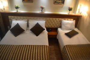 Postel nebo postele na pokoji v ubytování Seven Days Hotel - İstanbul