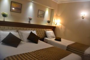 Postel nebo postele na pokoji v ubytování Seven Days Hotel - İstanbul