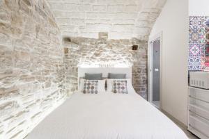 Posteľ alebo postele v izbe v ubytovaní San Nicola Old Town Apartment Casatuabari