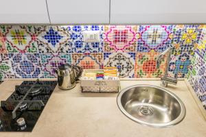 Kuchyňa alebo kuchynka v ubytovaní San Nicola Old Town Apartment Casatuabari