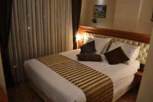 Postel nebo postele na pokoji v ubytování Seven Days Hotel - İstanbul