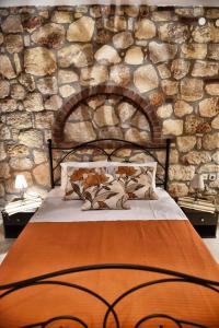 Postel nebo postele na pokoji v ubytování Sunstone Villas