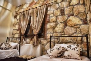 Postel nebo postele na pokoji v ubytování Sunstone Villas