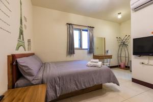 Postel nebo postele na pokoji v ubytování Jia Xiang Lin Guan Hai Homestay + 3 fotografie