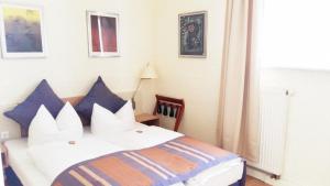 Postel nebo postele na pokoji v ubytování Hotel Goldener Anker