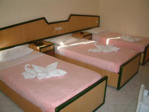 Ліжко або ліжка в номері Diana Hotel Hurghada