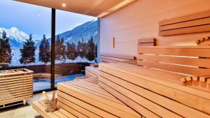 
a view from a balcony of a cabin with a view of a lake at Mountain Spa Residences in Sankt Anton am Arlberg
