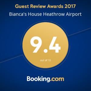 a sign that says guest review awards blanzas house hairthrow airport at Bianca's House Hotel Heathrow Airport in Hillingdon