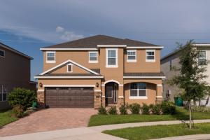 a large house with a driveway at Luxury Dreams Disney Home with Private Pool and Spa in Orlando