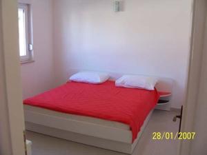 Una cama o camas en una habitación de Apartments Perdijic Nemira