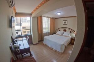 Postel nebo postele na pokoji v ubytování Hotel Oro Inn