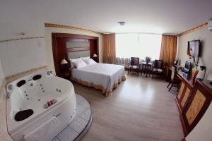 Postel nebo postele na pokoji v ubytování Hotel Oro Inn