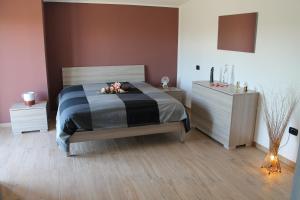 Un pat sau paturi într-o cameră la L'AMENA QUISISANA