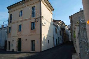 a building with a clock on the side of it at B&B La Terrazza Sul Borgo - Ortona Rooms in Ortona