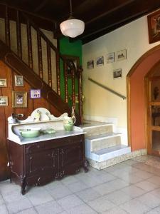 a room with stairs and a table with bowls on it at CasaDelias in Granada