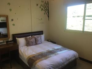 Giường trong phòng chung tại Siangting B&B