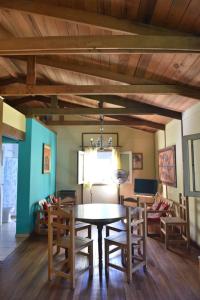 a dining room with a table and chairs at Los Arrayanes in Tandil