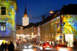 a busy city street at night with cars at Apartment in Warmbad Villach in Villach