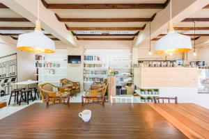 a dining room with a table and chairs at Pure Phuket Residence in Phuket