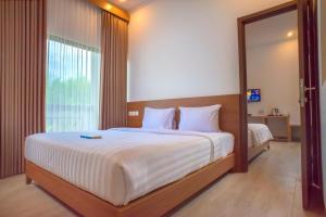 
A bed or beds in a room at Java Village Resort
