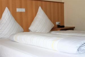 Postel nebo postele na pokoji v ubytování Hotel America