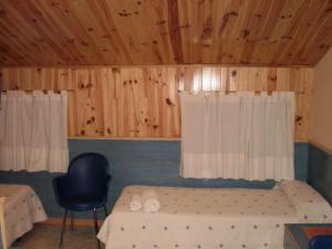 Postel nebo postele na pokoji v ubytování Hostal El Cartero