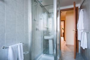 a bathroom with a shower and a sink at Casa Vacanze Samira in Fondachello