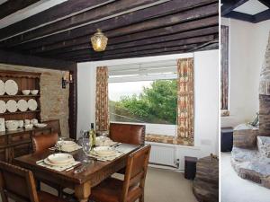 a dining room with a table and a window at Blue Horizon in Brixham +17 photos