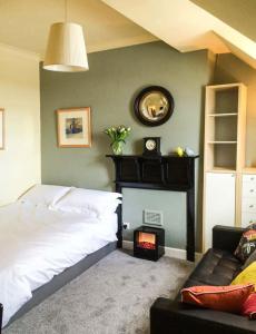 a bedroom with a bed and a fire place at The Feversham in York