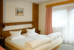 Postel nebo postele na pokoji v ubytování Pension Ötztalerhof