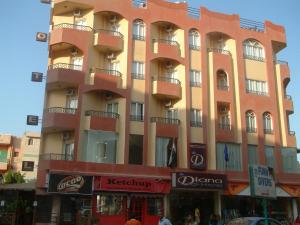 a tall building with balconies on the side of it at Diana Hotel Hurghada in Hurghada