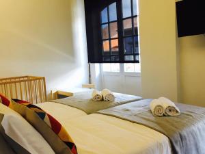 Cama o camas de una habitación en Globo Happy Hostel