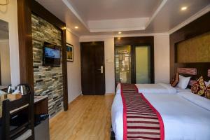 Rúm í herbergi á Kuti Resort & Spa