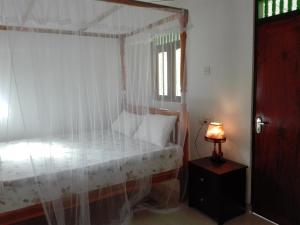 Postel nebo postele na pokoji v ubytování Calm Garden Cabanas