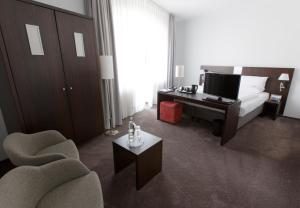 Postel nebo postele na pokoji v ubytování Astor & Aparthotel