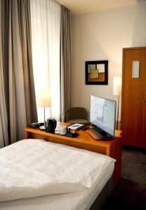 TV a/nebo společenská místnost v ubytování Astor & Aparthotel