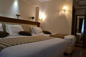 Postel nebo postele na pokoji v ubytování Seven Days Hotel - İstanbul