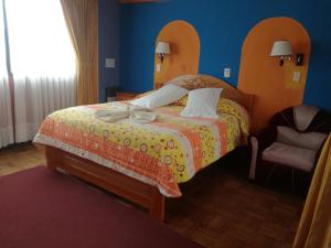 Postel nebo postele na pokoji v ubytování Hotel Utama