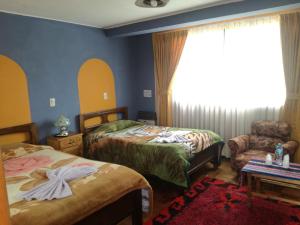 Postel nebo postele na pokoji v ubytování Hotel Utama