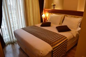 Postel nebo postele na pokoji v ubytování Seven Days Hotel - İstanbul