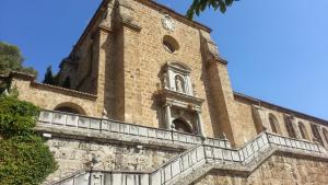 a large brick building with a clock tower on it at Ca' Vaschino in Granada
