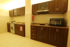 מטבח או מטבחון ב-Corp Executive Hotel Doha Suites