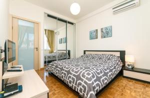 Ένα ή περισσότερα κρεβάτια σε δωμάτιο στο Alma Apartments