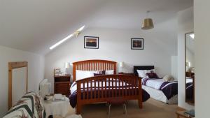 Rúm í herbergi á Corrib View Lodge