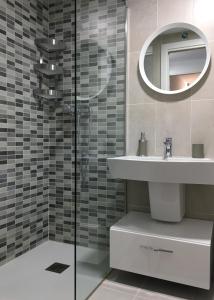a bathroom with a sink and a mirror at Apartment Santa Teresa in Altea
